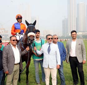 Jiyaji Bhosale, Jaisal Singh, Vikram Bachawat and trainer Adhirajsingh Jodha leading in Diego Garcia (Suraj Narredu up), winner of Oyster Cove Trophy at Mumbai on Saturday.